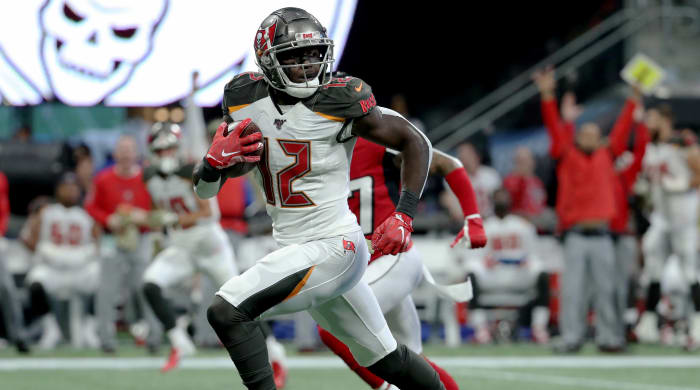 Nov 24, 2019; Atlanta, GA, USA; Tampa Bay Buccaneers wide receiver Chris Godwin (12) runs for a long touchdown catch in the first quarter against the Atlanta Falcons at Mercedes-Benz Stadium. Mandatory Credit: Jason Getz-USA TODAY Sports